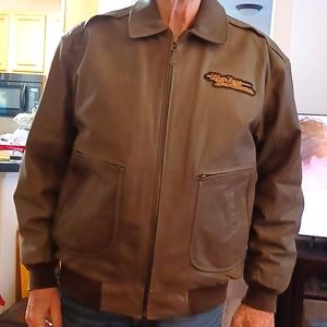 Harley Davidson patches, leather bomber jacket.  Minimal wear.